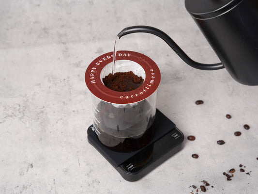 Home barista measuring espresso shots with a digital coffee scale